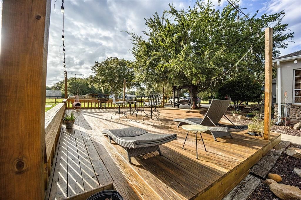 Soak up the rays and unwind in style on this inviting tanning deck and lounge area