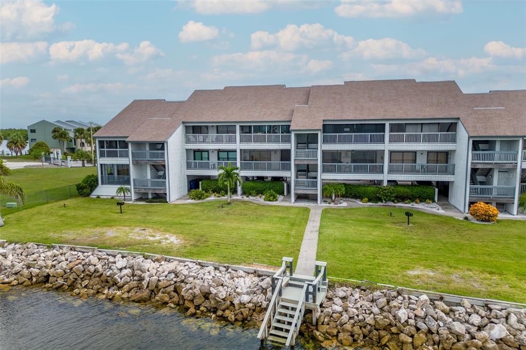 Aerial View of Back of Building.  Sidewalk Leading to Dock