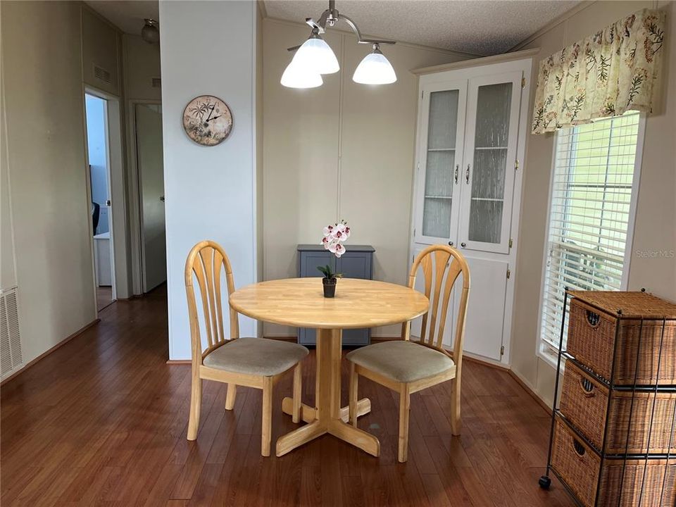 Dining Area has built-in corner cabinet