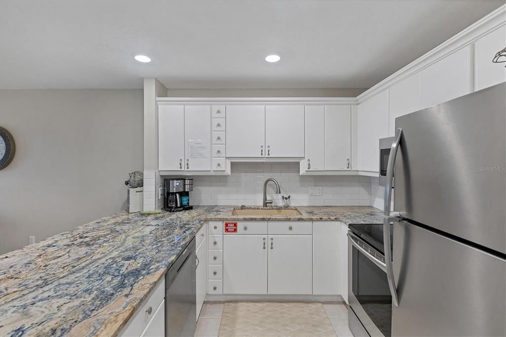 Coastal kitchen with gorgeous granite and stainless steel appliances!