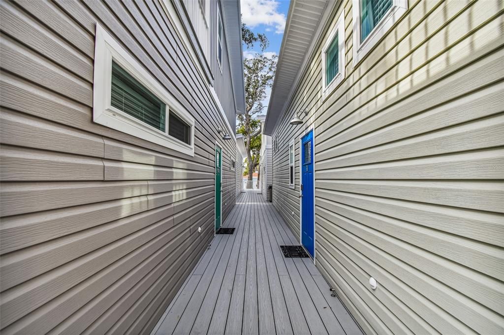 Walkway between tiny homes with front door