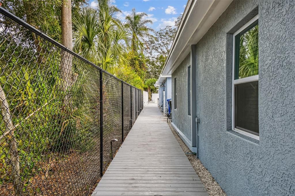 Boardwalk that runs from front of property to trail