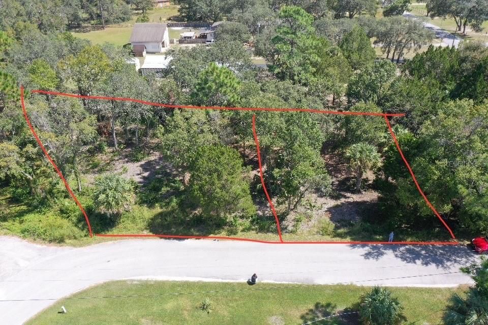 Perfect opportunity to get OVER half an acre of land! (This property is on the left)
