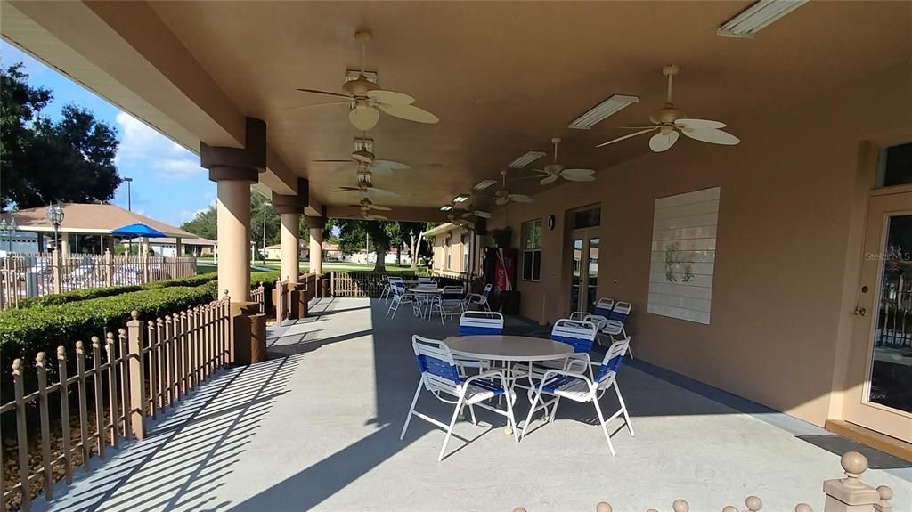 shaded seating area looking out to pool