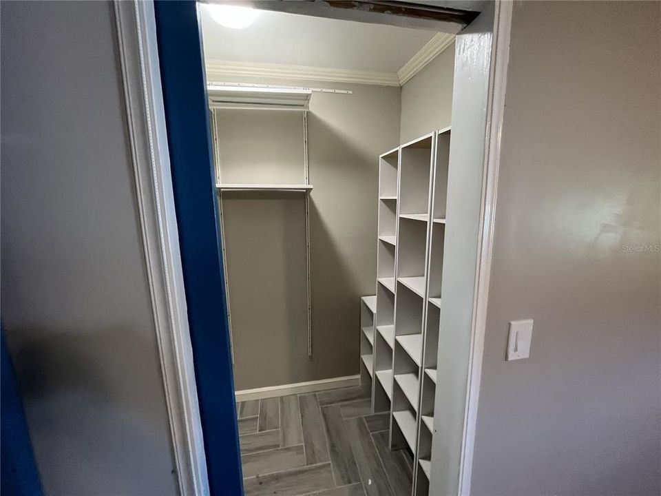 2nd bedroom with walk-in closet organizer