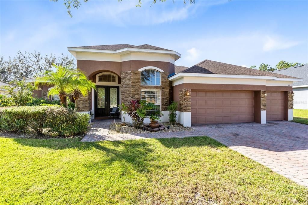 Spacious 3 Car Garage and Driveway