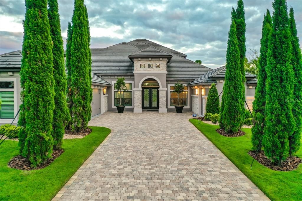 Beautiful Approach with Evergreens Lining Driveway