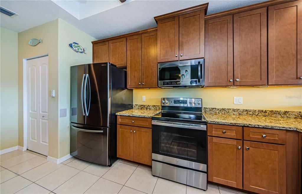 Kitchen with lots of storage, stainless steel appliances and a large pantry!