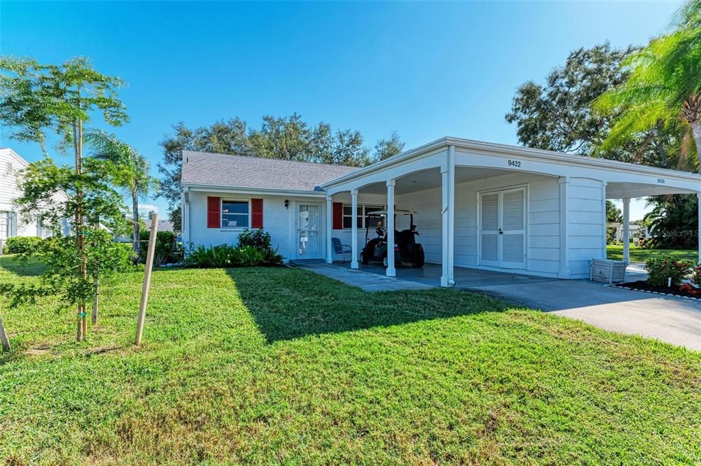 Front of villa with carport