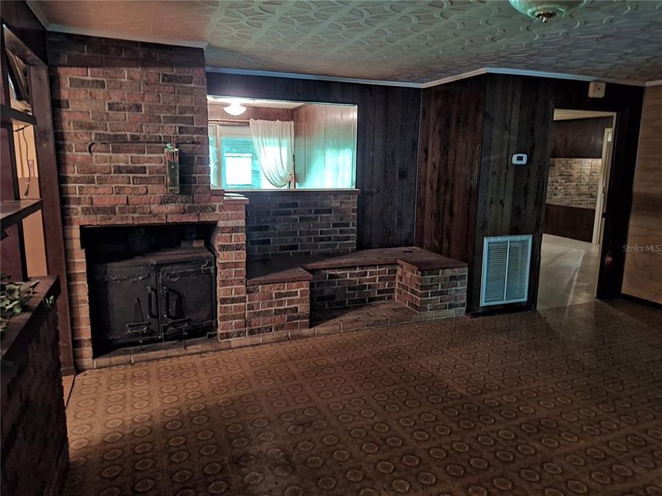 Brick Wall of seating and Cast Iron Fireplace Stove