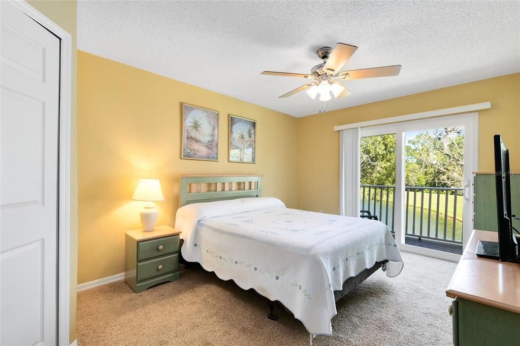 Upstairs Primary Suite with private balcony overlooking pond!