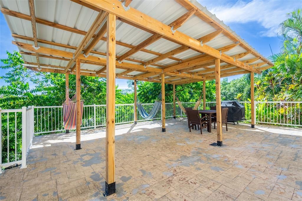 Covered patio and grill on bottom floor