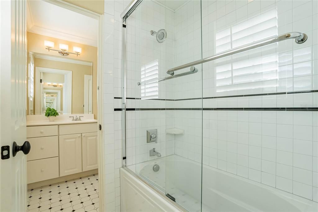 The Jack and Jill bath features two separate vanity spaces, and shares the tub/shower combo.