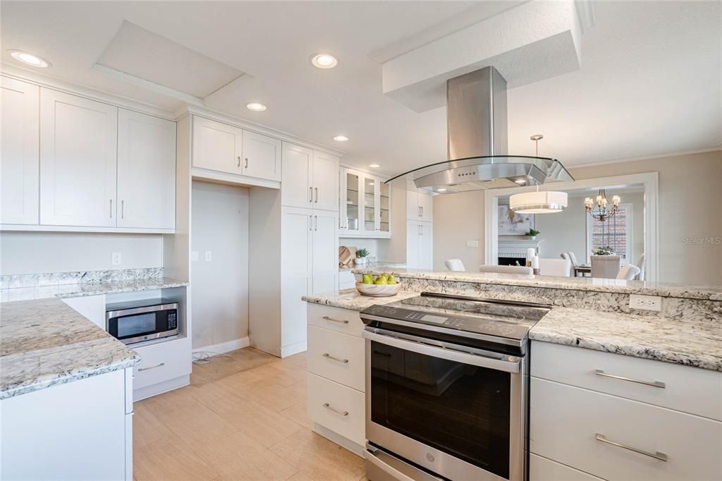 Gorgeous granite counters and stainless steel appliances make all cooking endeavors a delight.