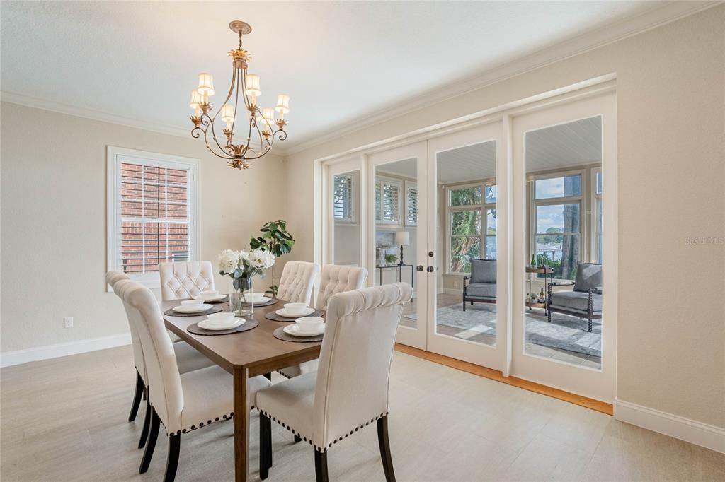 French doors to the sunroom can be found just off the dining room.