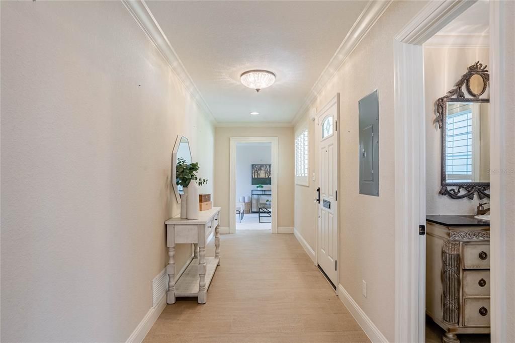 As you enter the inviting foyer, you'll immediately be enveloped in the elegance and charm that define this remarkable home.