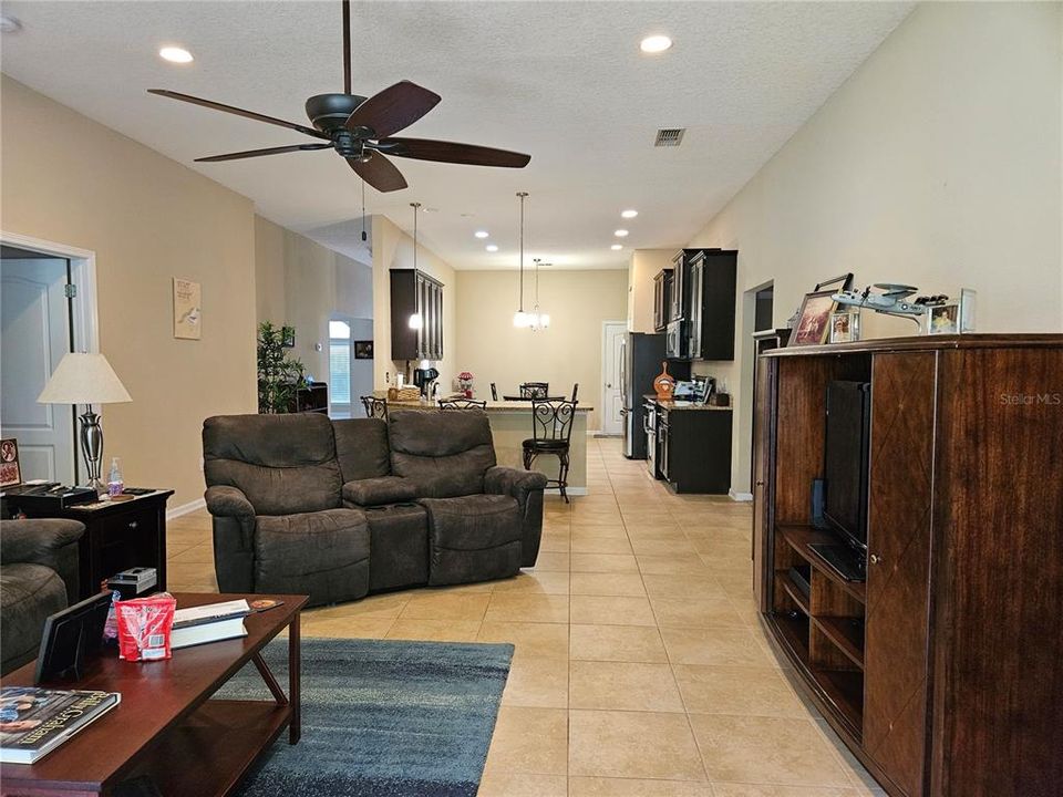 Looking into family room and kitchen from the screen porch.