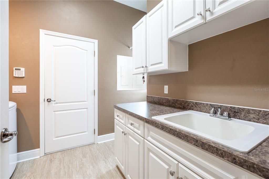 Laundry room utility sink and storage