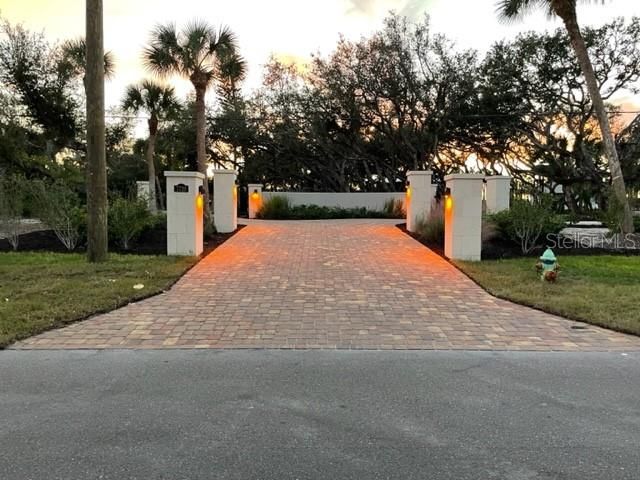 New pavers, stone piers and gates