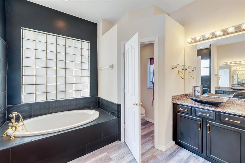 Master Ensuite with split vanities, garden tub, shower stall, water closet with Bidet