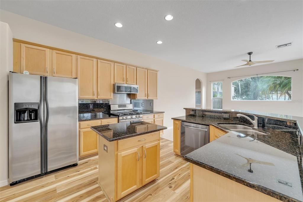 Kitchen with Granite countertops and backsplash