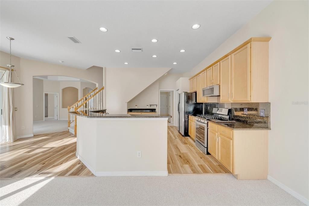 Kitchen with Granite countertops and backsplash