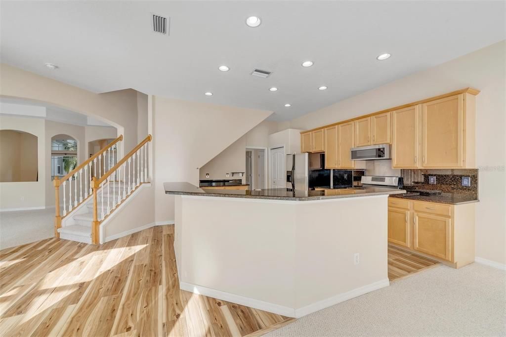 Kitchen with Granite countertops and backsplash