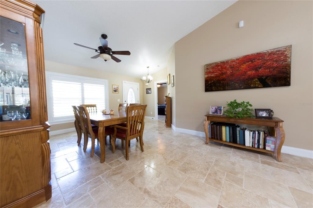 Dining Room with travertine floors throughout home