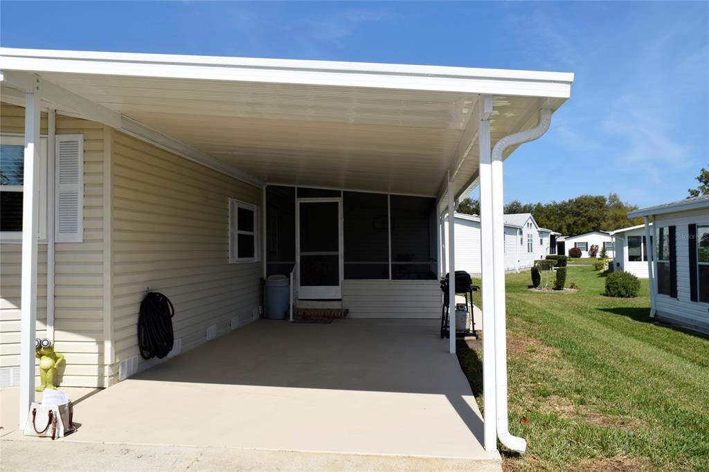 CARPORT TOWARD SCREENED ROOM