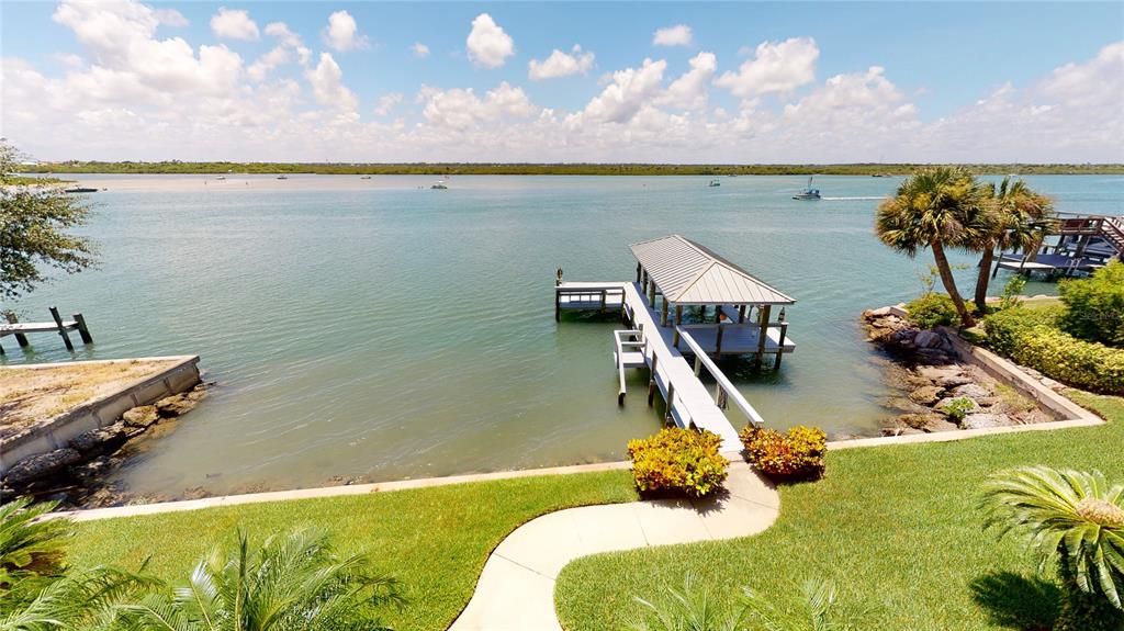 Spectacular views of the Indian River from every room in this stunning home! Watch the yachts sail by and the dolphins jump & the pelicans dive for fish from your private back yard!