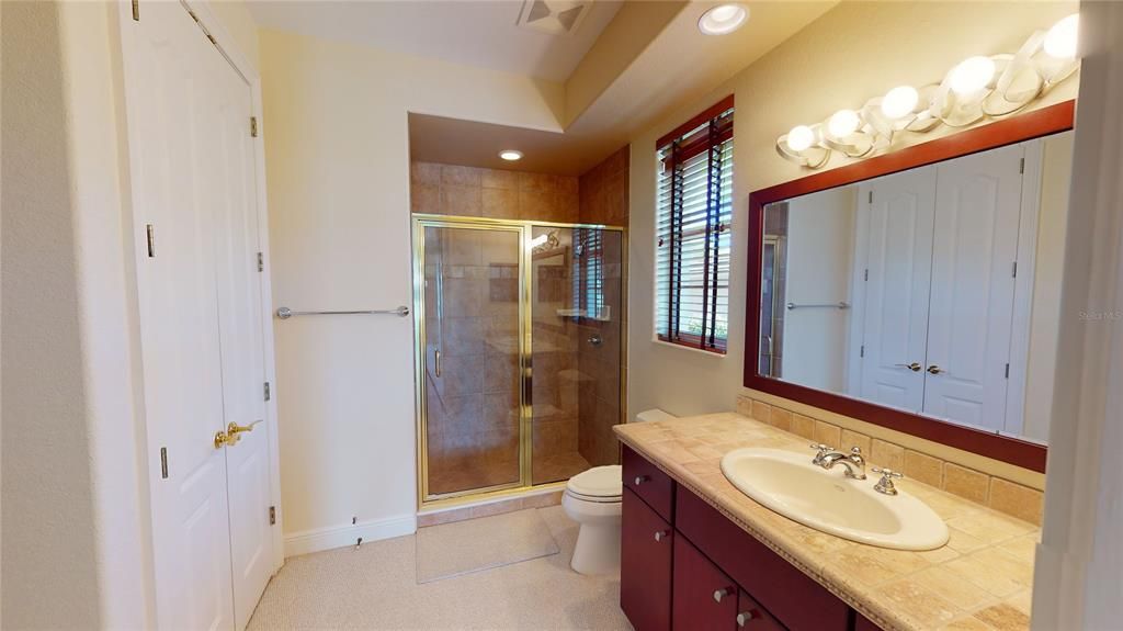 Master bath upstairs features step in shower.