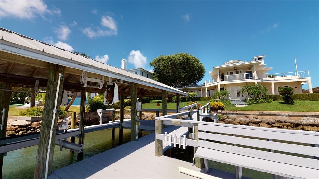 Wonderful boat dock with lift to enjoy fishing, or just relaxing while watching the dolphins & the yachts go by. Beautiful sunsets everyday!