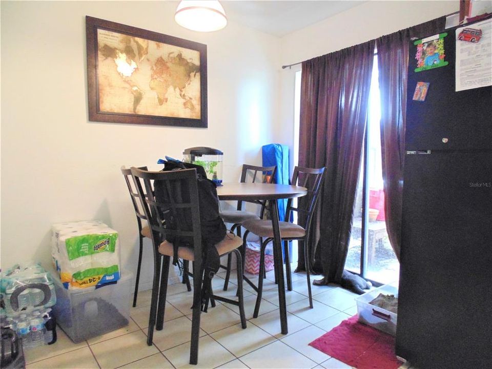 Dining Area in Kitchen and sliders that lead to patio