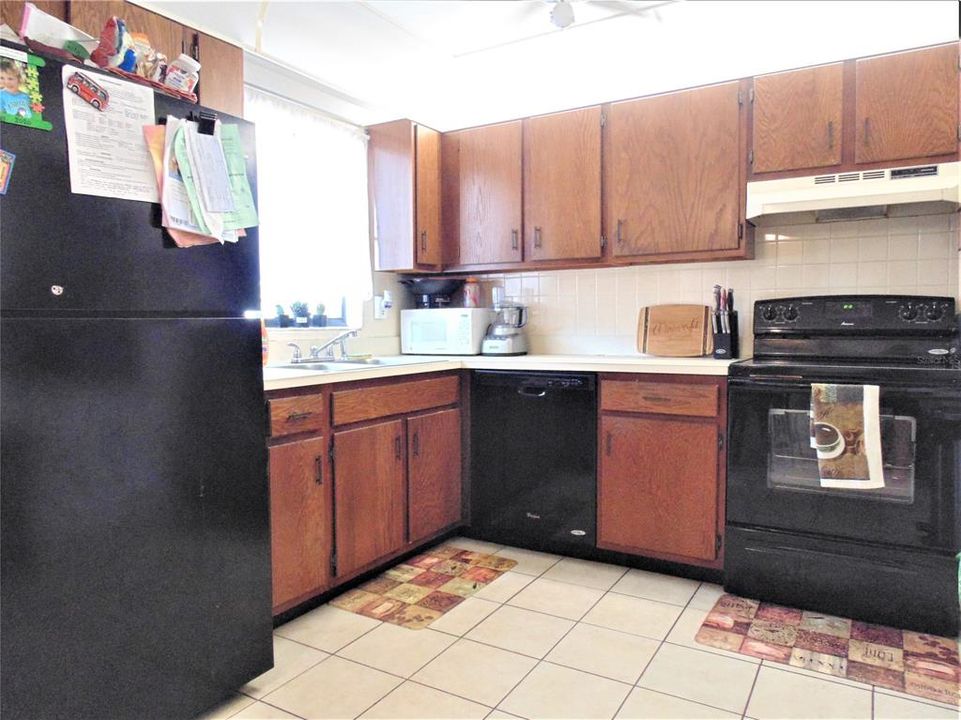 Kitchen has all appliances and tile floor