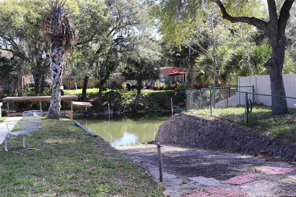 View of the boat ramp and the fenced in dog run to the right.