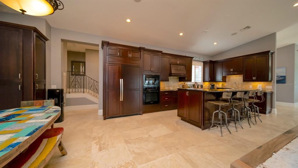 Custom Kitchen with Island Counter and massive walk-in pantry room