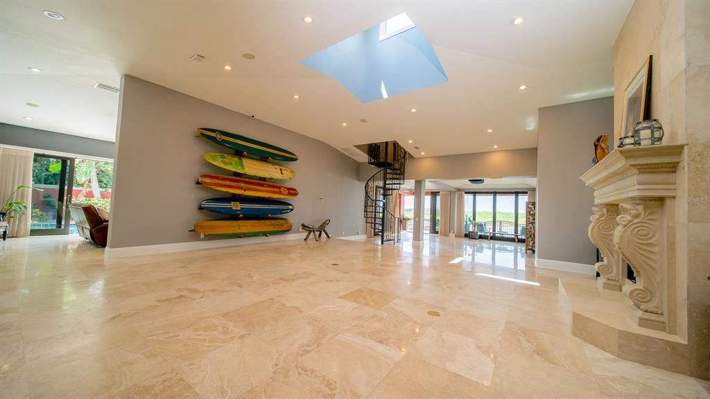 Travertine Floors Throughout.  Natural light from windows and copula.