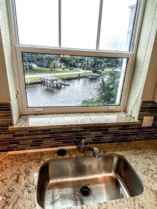 LARGE WINDOW OVER SINK, VIEW OF RIVER.