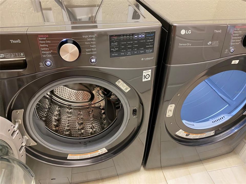 LG WASHER AND DRYER W/ STEAM.