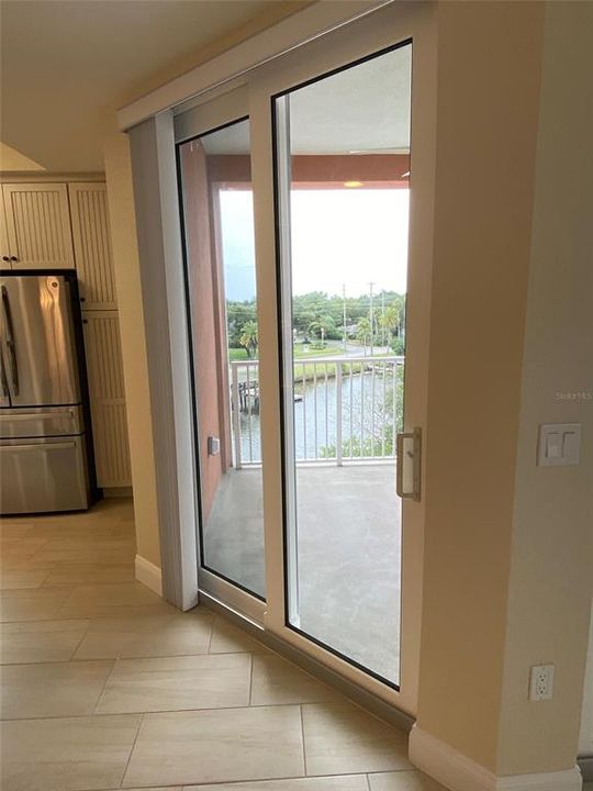 SECOND SLIDING GLASS DOOR LEADING TO THE BALCONY.