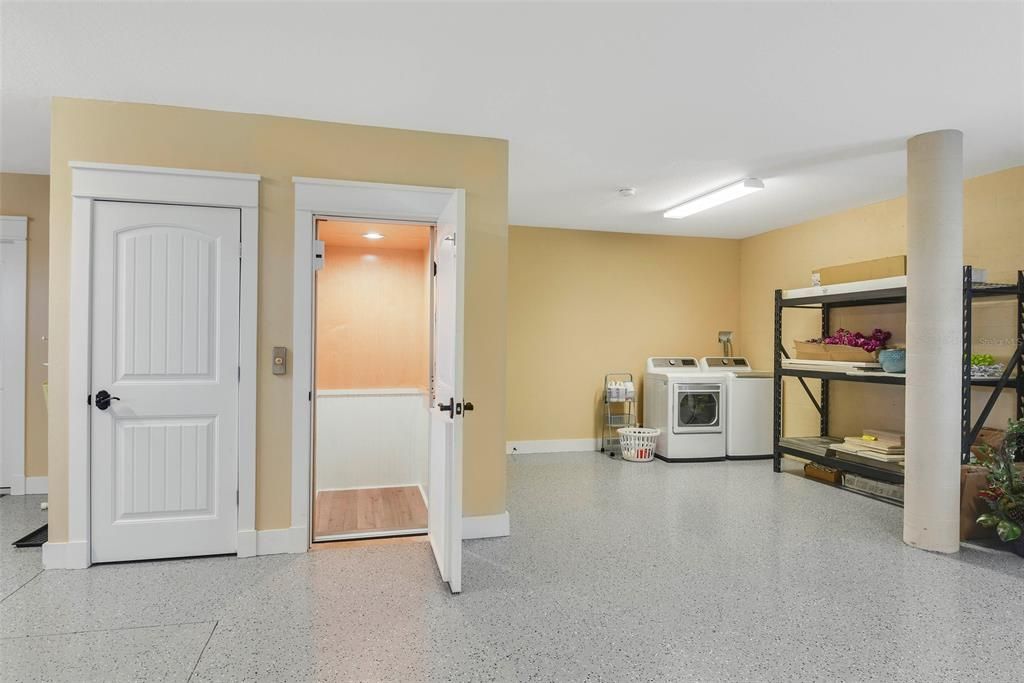 HUGE Garage w/ 2nd full laundry area and direct access to Foyer and Elevator