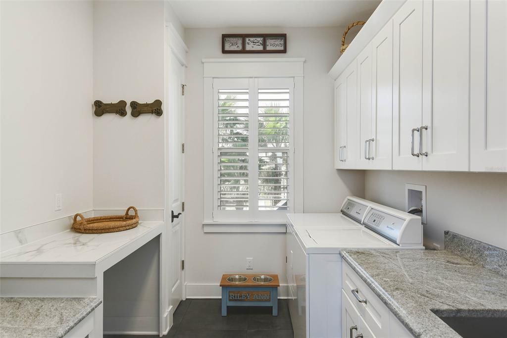 Laundry Room with Folding Counter and Desk and Stainless Work Sink