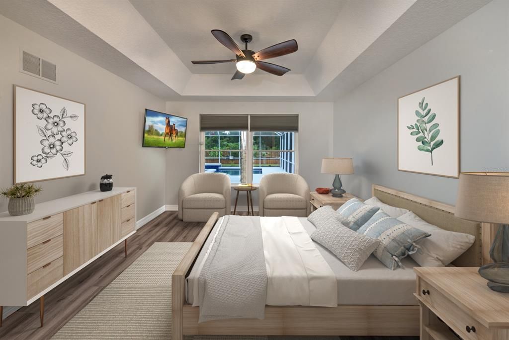 Owner's suite with tray ceiling and views of the lanai and pool area.