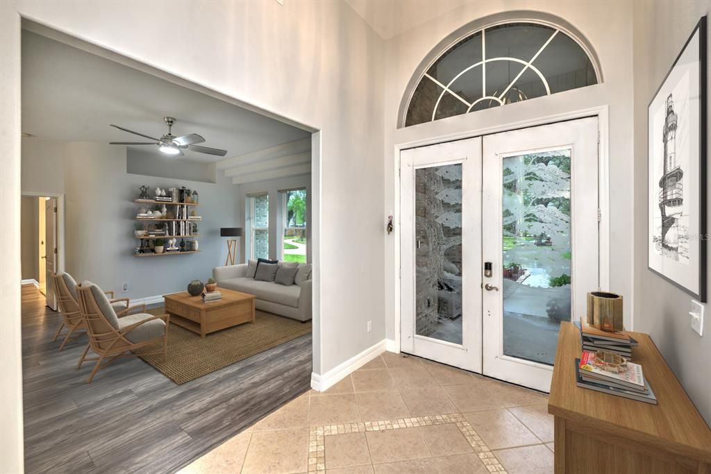 Tiled foyer with 12 foot ceiling, double entry, etched doors.