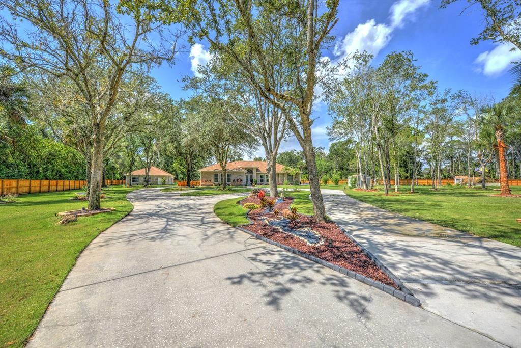 Long, circular driveways offering plenty of parking for guests.