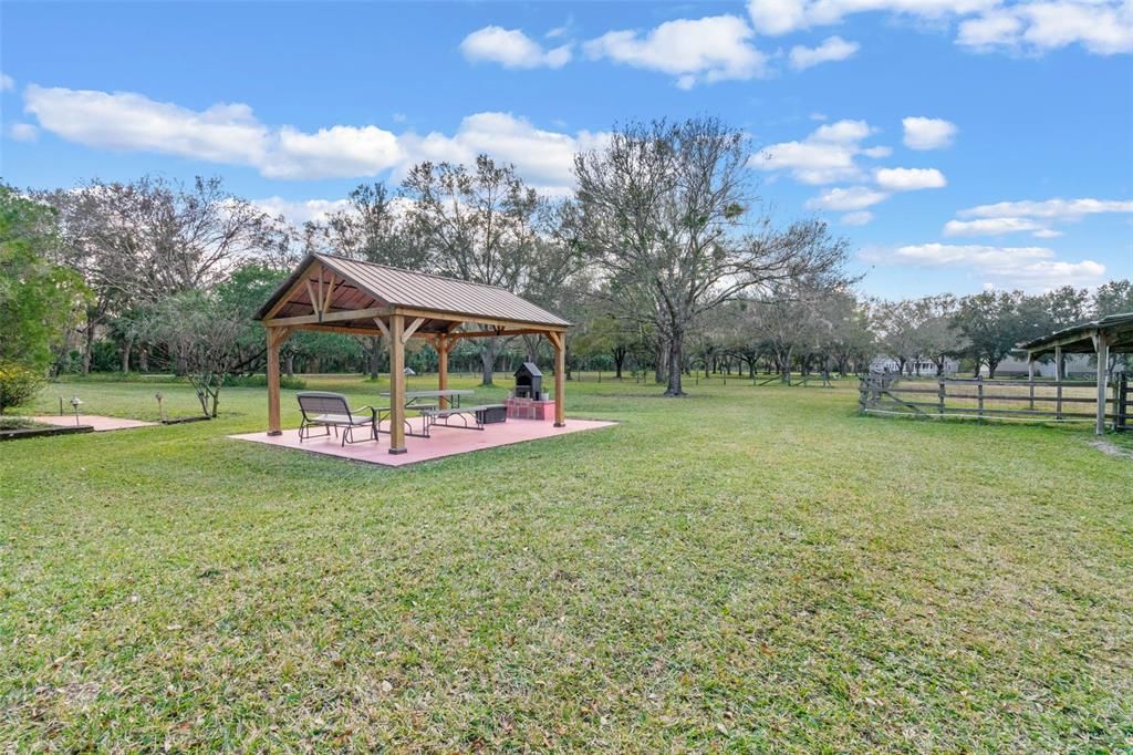 Relax under the gazebo or enjoy the outdoor oven.