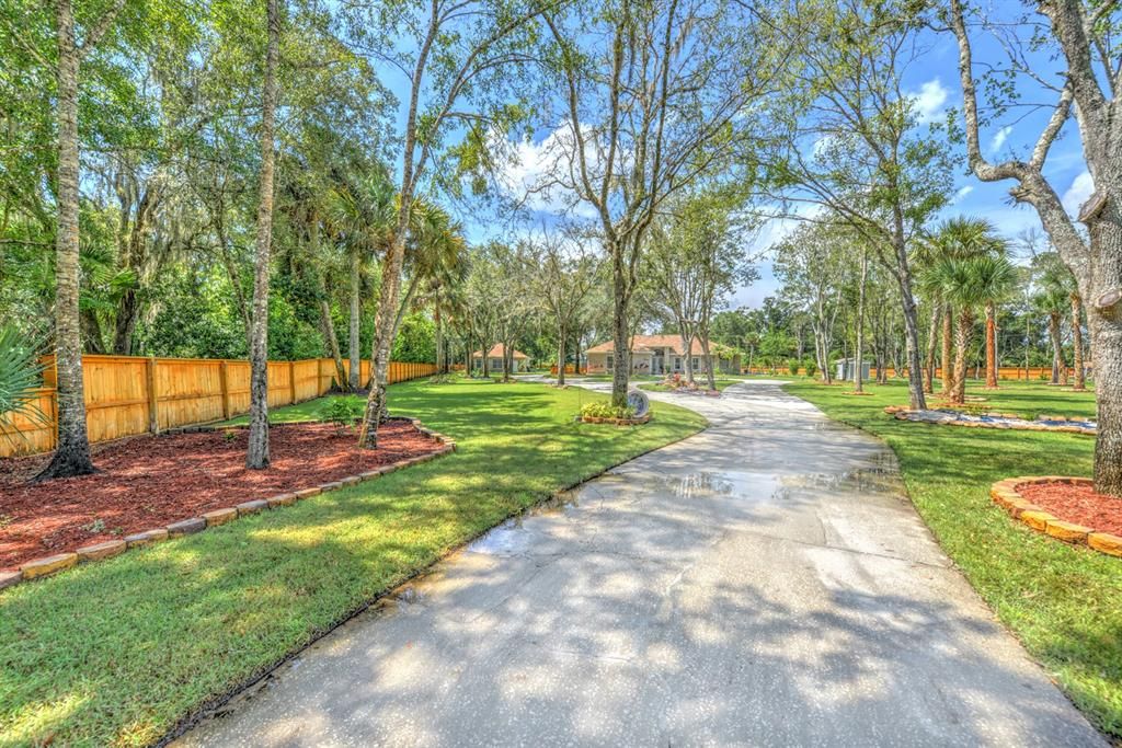 2.5 acres offering beautiful trees and two lovely homes.