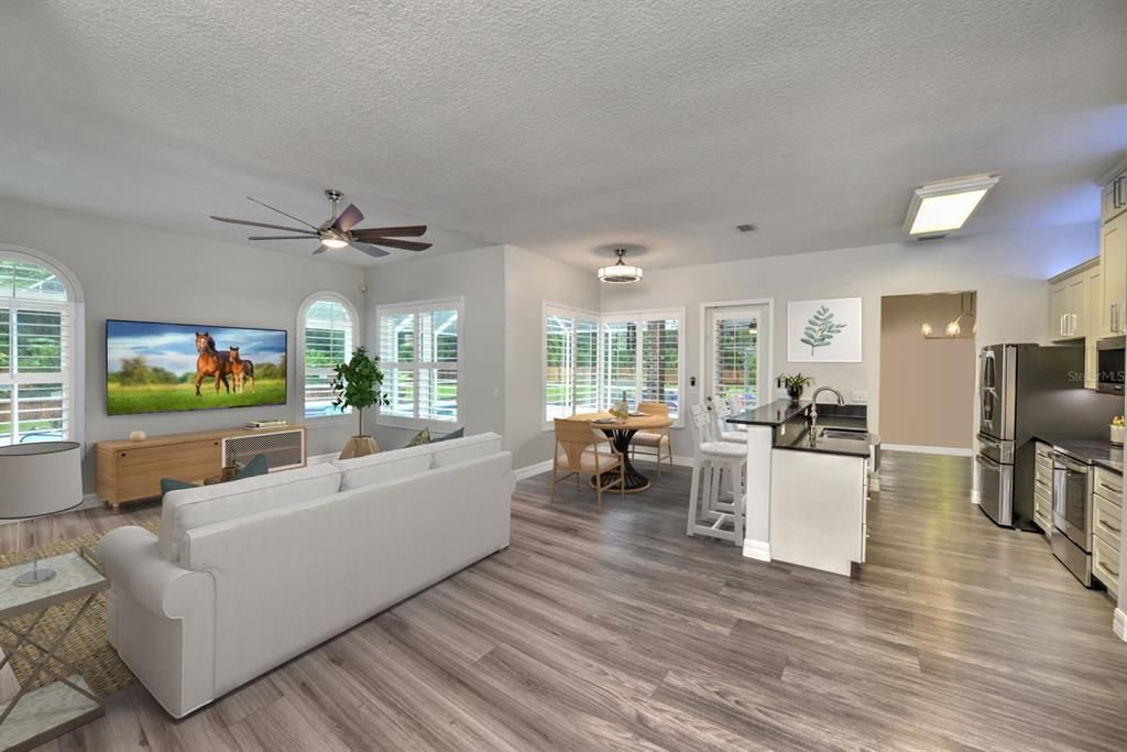 Bright open flor plan! Family room & open kitchen have a lovely flow for entertaining. Wrap around windows allow you to view the pool at all times.