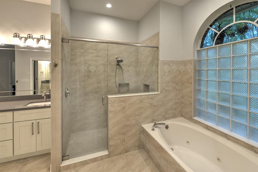 Jetted tub & walk-in shower.