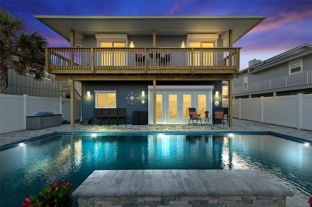 GORGEOUS SALT WATER HEATED AND CHILLED POOL WITH FOUNTAIN. NOTICE MOTORIZED HURRICANE SHUTTERS.